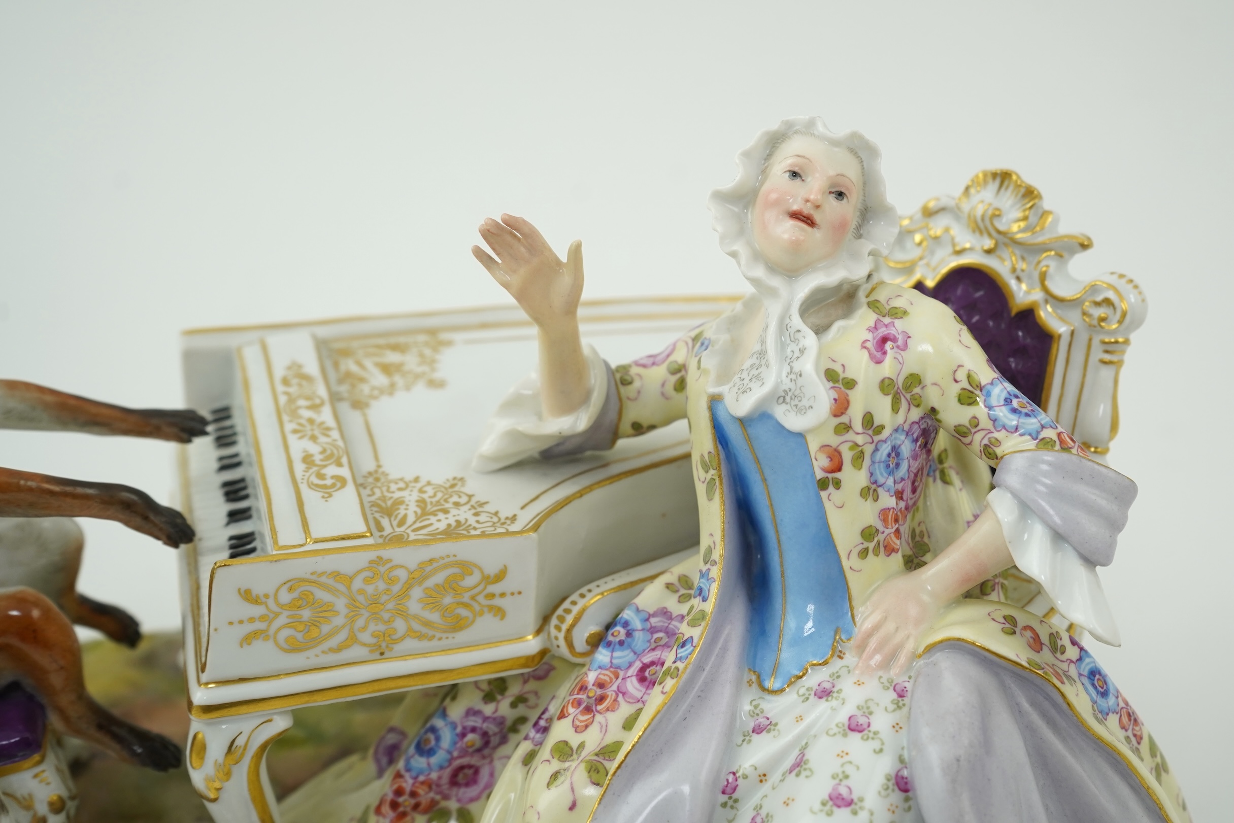 A Meissen group of a fox at the piano and a lady listening, after J. J. Kandler, late 19th century